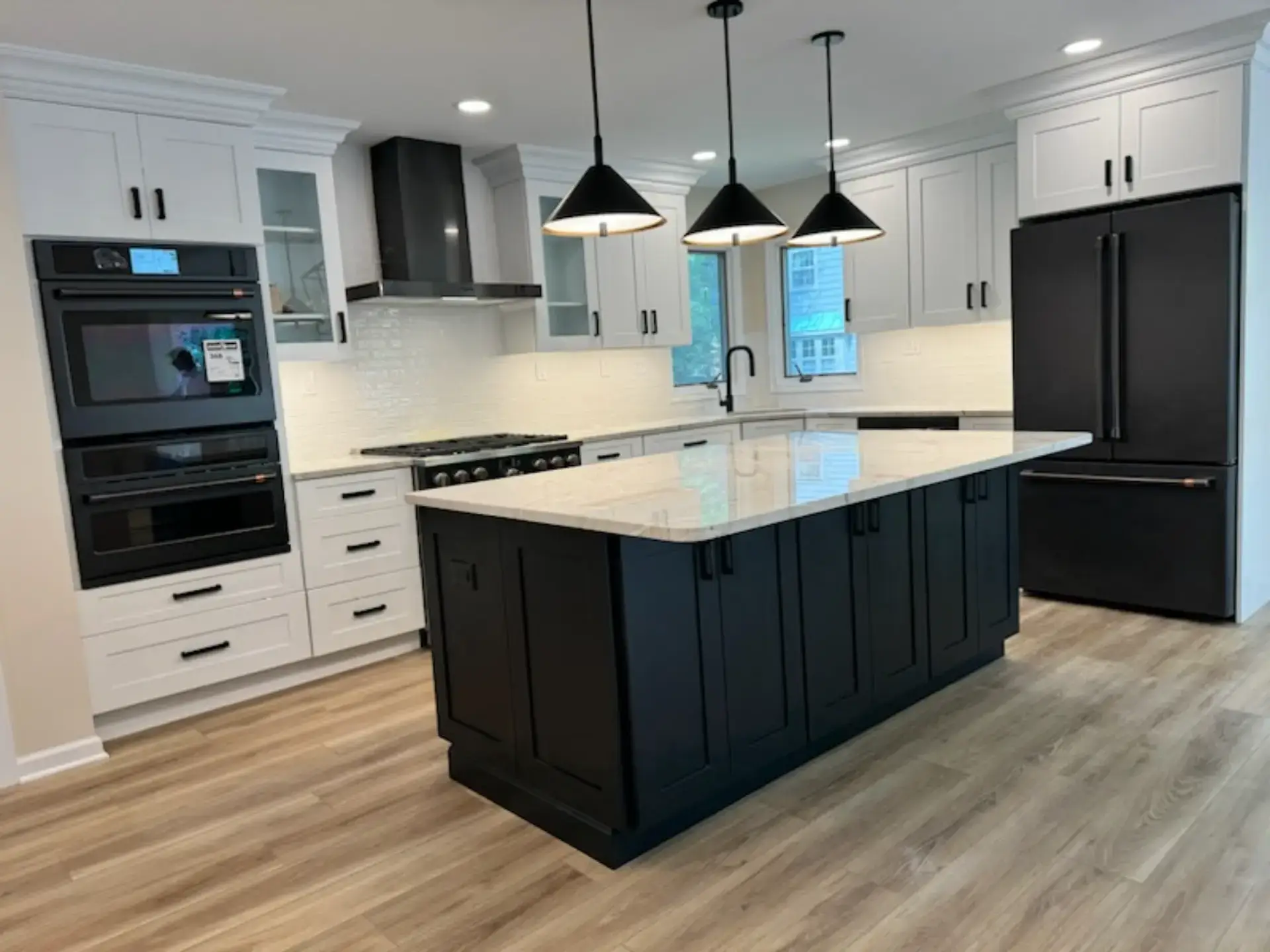 Navy island with a white stone top and black pendants